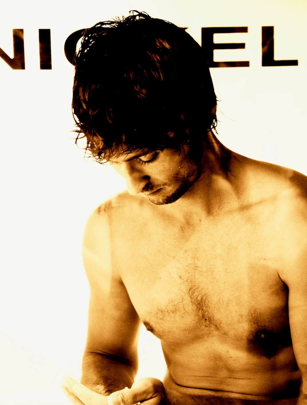 A male artist having a shower in public as an art perfromance