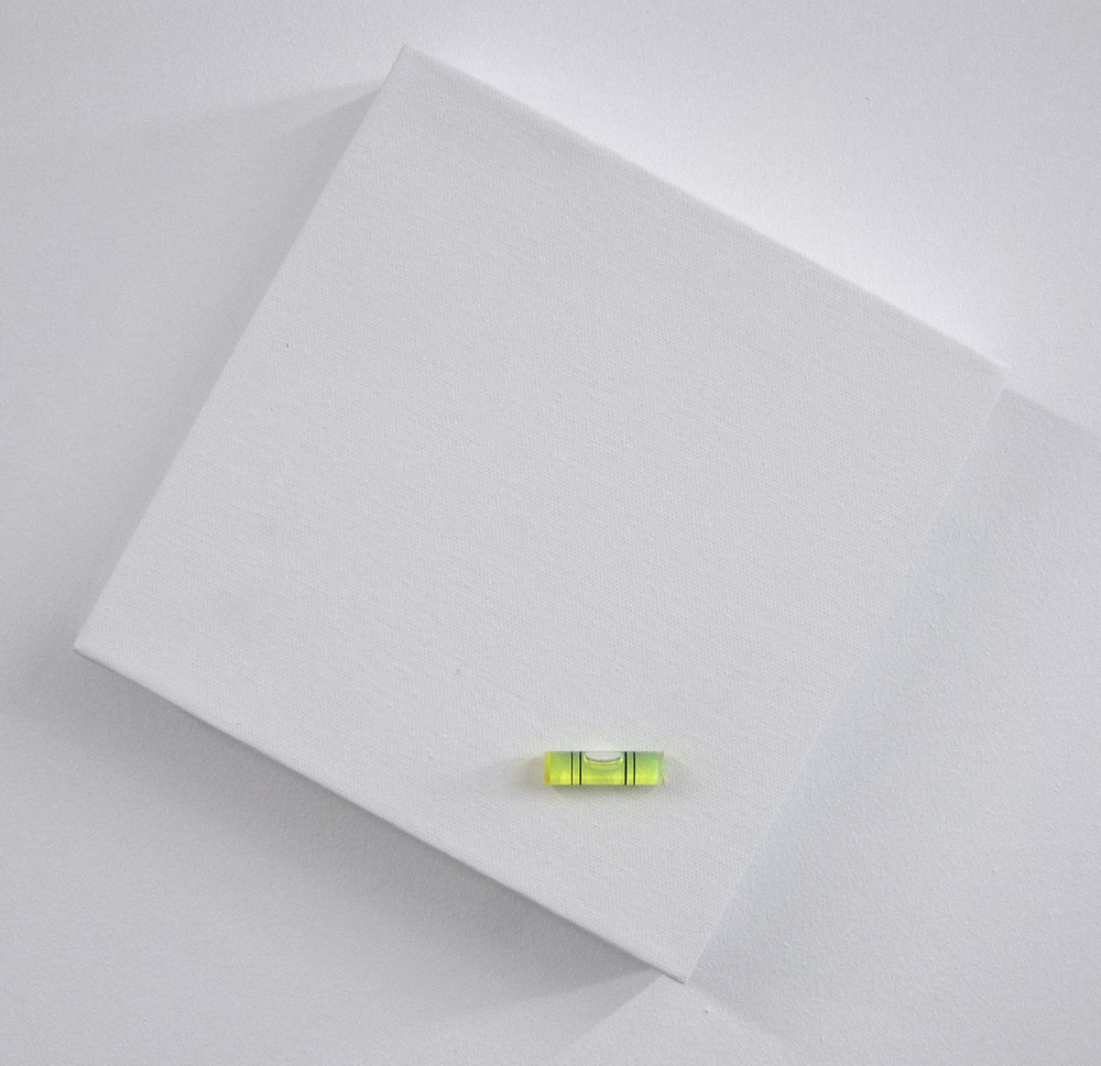 Janko Matic spirit level glued at a random angle onto a canvas frame